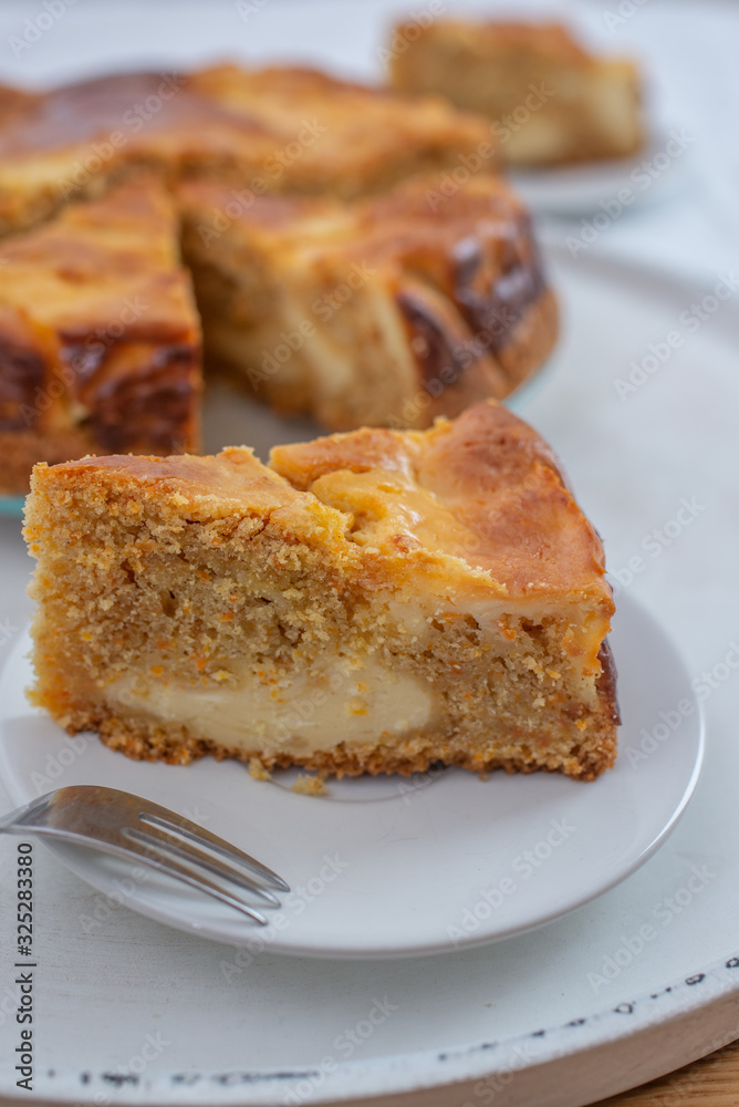 home made carrot cake cheesecake on a table home made carrot cake cheesecake on a table