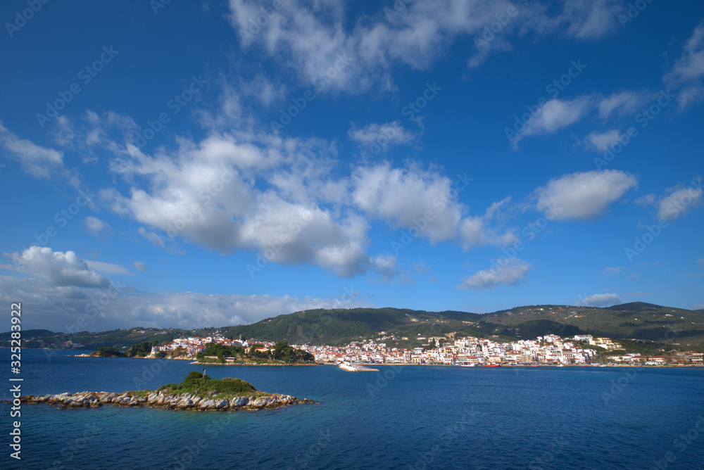Skiathos island , the most famous island of Greece is one of the most famous Greek destinations in the whole world, here we see a view of the island from a ship. Famous for its beaches, one of the bes