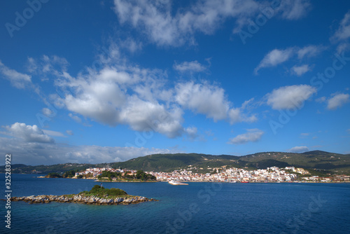 Fototapeta Naklejka Na Ścianę i Meble -  Skiathos island , the most famous island of Greece is one of the most famous Greek destinations in the whole world, here we see a view of the island from a ship. Famous for its beaches, one of the bes