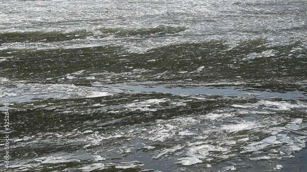 Brash ice floating next to ice laying still Brash ice floating next to ice laying still