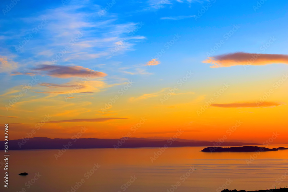 Sunset , sunset on the islands of the Aegean, Greece, SporadesGreece , Mediterranean Sea ,  Aegean sea  ,  Skiathos island  ,Skopelos island vacation in Greece .