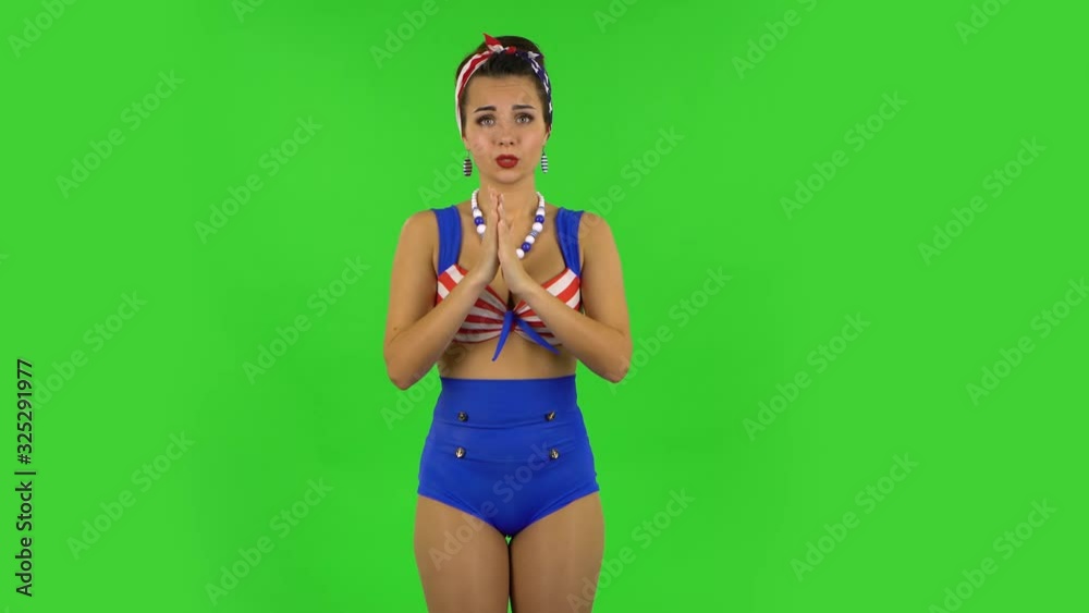 Beautiful girl in a swimsuit is looking at camera with anticipation, then very upset. Green screen Beautiful girl in a swimsuit is looking at camera with anticipation, then very upset. Green screen