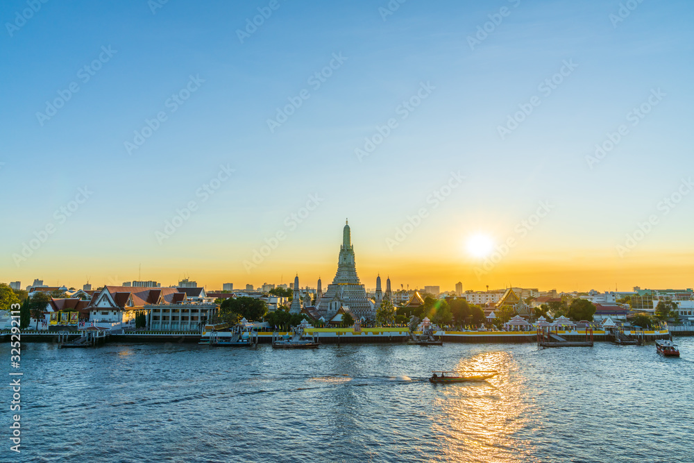 in Bangkok with Wat Arun temple and Chao Phraya River at sky sunset time, Wat Arun are travel destination of Bangkok, Thailand.