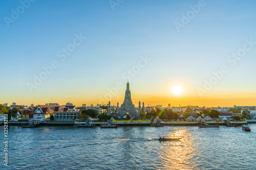 in Bangkok with Wat Arun temple and Chao Phraya River at sky sunset time, Wat Arun are travel destination of Bangkok, Thailand. © RoBird