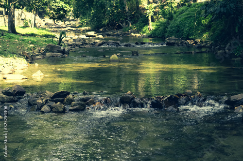 Small waterfall  in Thailand rainforest    fresh and relax nature wallpaper background