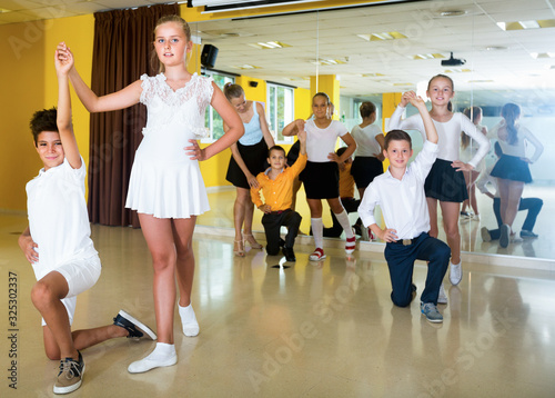 Little boys and girls having dancing class in classroom