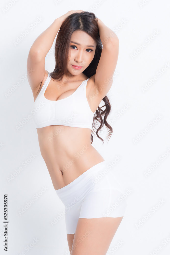 Beautiful fit woman brown long hair slim body wearing white underwear isolated on white background. Beautiful fit woman brown long hair slim body wearing white underwear isolated on white background.