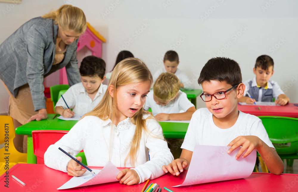 Fototapeta premium Children discussing during lesson