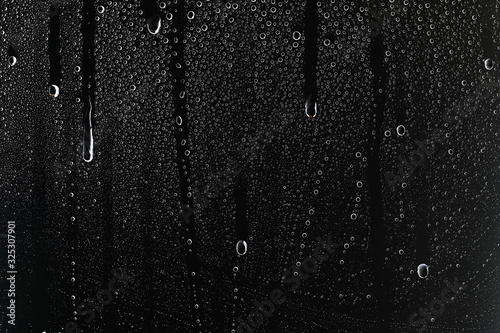 Fototapeta black wet background / raindrops for overlaying on window, concept of autumn wea