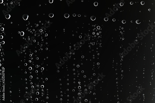 black wet background   raindrops for overlaying on window  concept of autumn weather  background of drops of water rain on glass transparent
