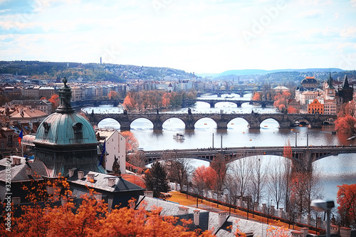 landscape yellow autumn prague / panoramic view of the red roofs of Prague, the czech Indian summer landscape with yellow trees