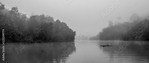 Beautiful view of misty lake surrounded with tropical rain forest, Borneo, Indonesia