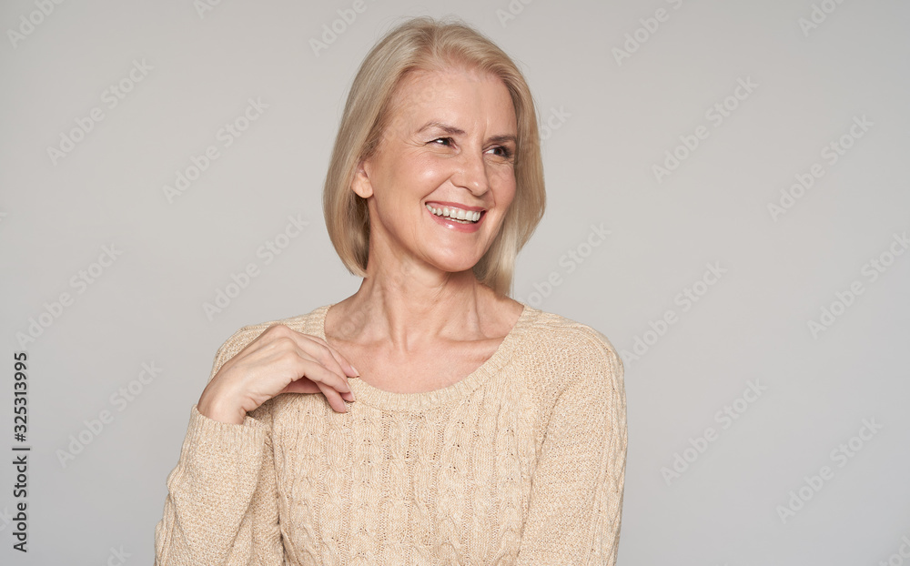 Close up portrait of beautiful older woman smiling. Isolated - obrazy, fototapety, plakaty 