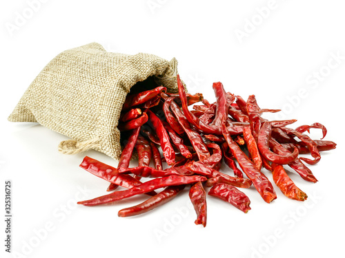 Pile crushed red pepper, Cayenne pepper, dried chili flakes isolated on white background photo