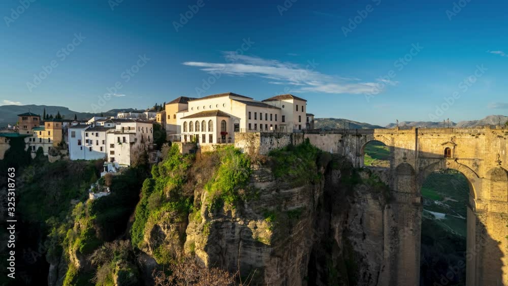 Ronda traditional Spanish white houses hanging off a cliff and huge old medieval bridge, 4k time lapse Ronda traditional Spanish white houses hanging off a cliff and huge old medieval bridge, 4k time lapse