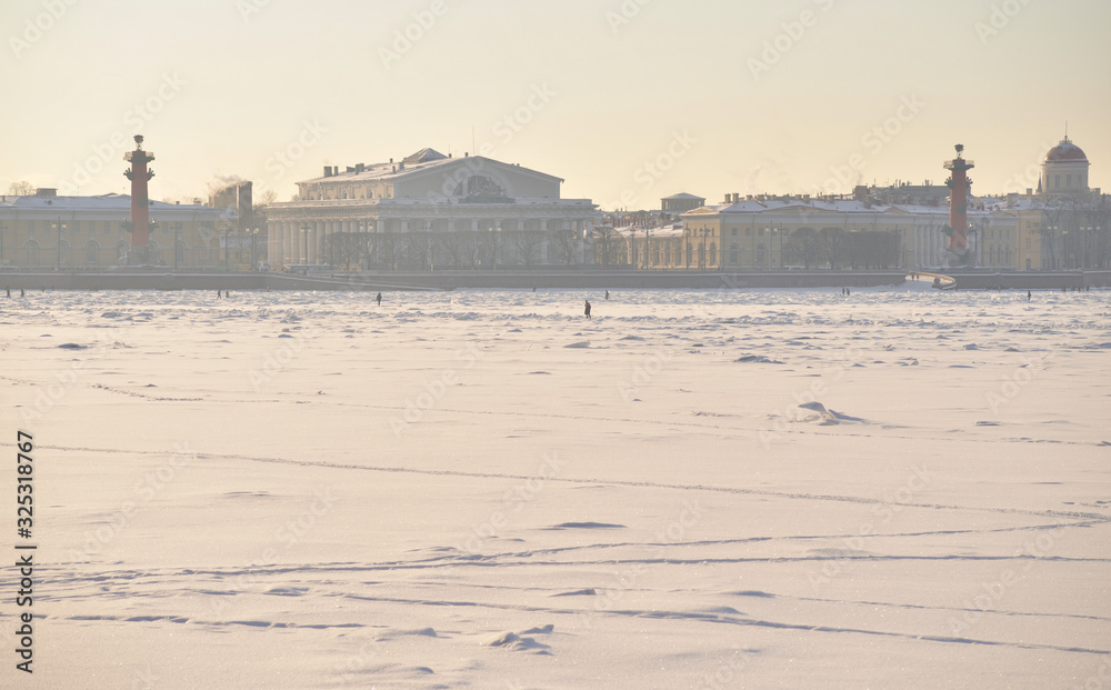 View of the arrow of Vasilievsky Island and frozen Neva river.