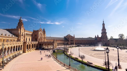 Plaza de España in Sevilla time-lapse tilting up on a sunny day with people enjoying Andalusian culture, 4k timelapse photo