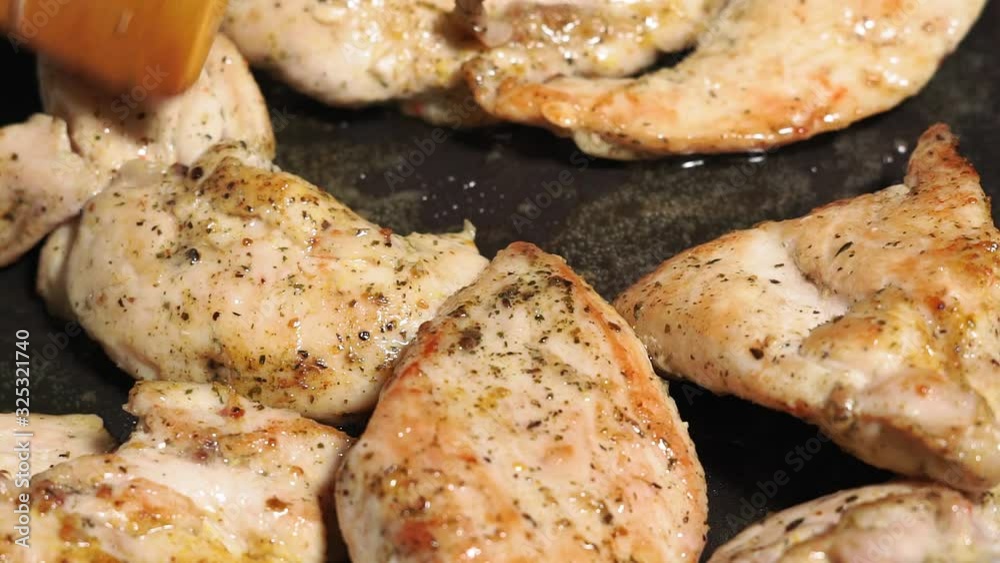 Pieces of chicken fillet are slowly fried in an open pan close-up. food preparation Pieces of chicken fillet are slowly fried in an open pan close-up. food preparation