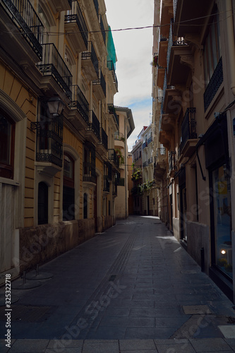 Lonely street in the old and picturesque neighborhood © Raul