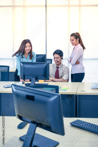 Group of young teamwork  businesspeople with headset and computer at office.