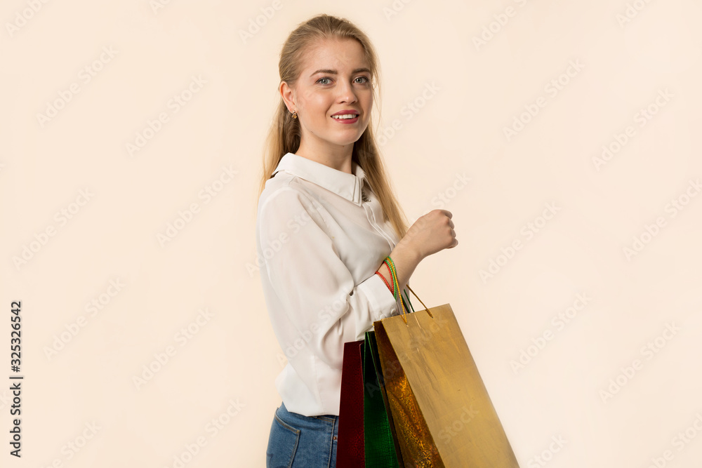 beautiful young woman with packages in hand