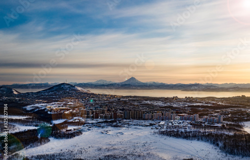 Fototapeta Naklejka Na Ścianę i Meble -  Beautiful view of Viliuchinsky Volcano, Krasheninnikova Bay, Avacha Bay at sunrise. Kamchatka. Russia