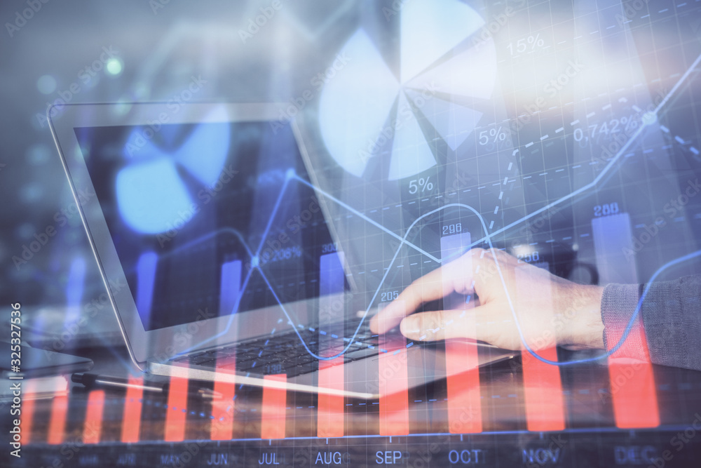 Double exposure of stock market graph with man working on laptop on background. Concept of financial analysis. Double exposure of stock market graph with man working on laptop on background. Concept of financial analysis.
