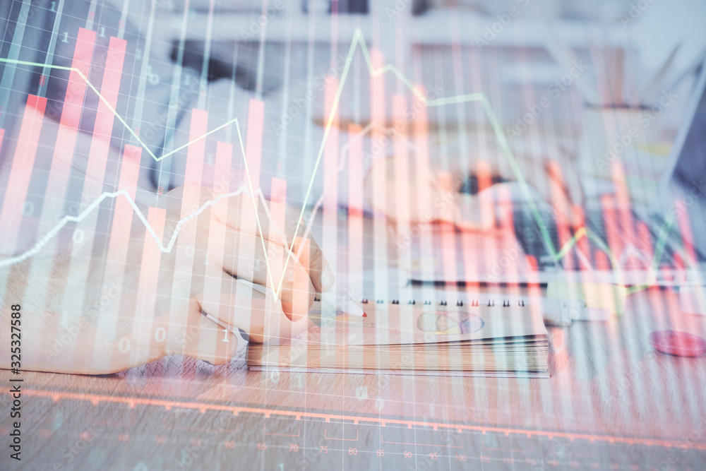 Multi exposure of financial graph with man works in office on background. Concept of analysis.