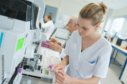 scientist working with blood sample in laboratory © auremar