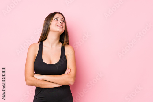 Young fitness caucasian woman isolated smiling confident with crossed arms.