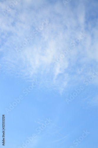 fluffy white cloud on clear blue sky