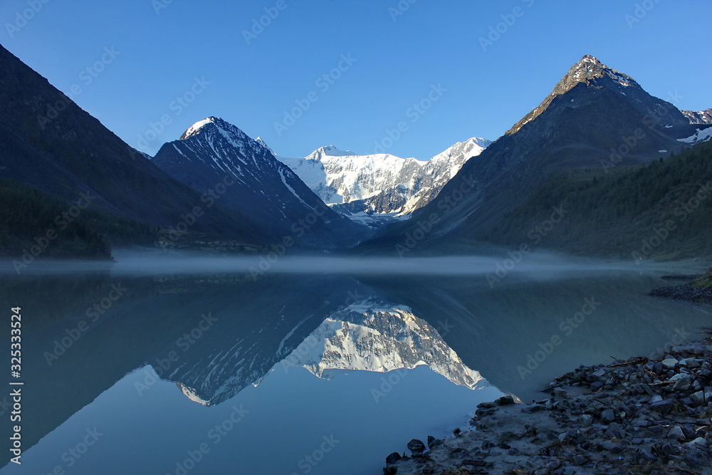 Akkem lake in Altai Republic. Mount Belukha, Altai Republic, Russia. Reflection of mountains in the Mount. Pass Kara-Turek