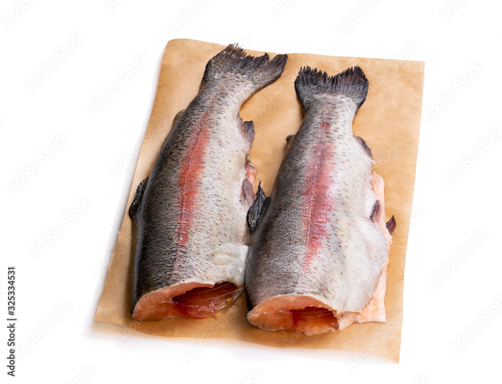 Fresh raw rainbow trout fish with head removed isolated on white Fresh raw rainbow trout fish with head removed isolated on white