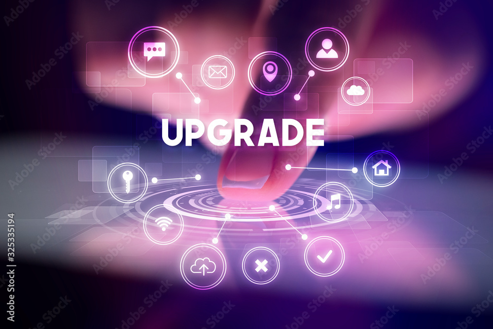 Finger touching tablet with web technology icons and UPGRADE inscription, web technology concept Finger touching tablet with web technology icons and UPGRADE inscription, web technology concept