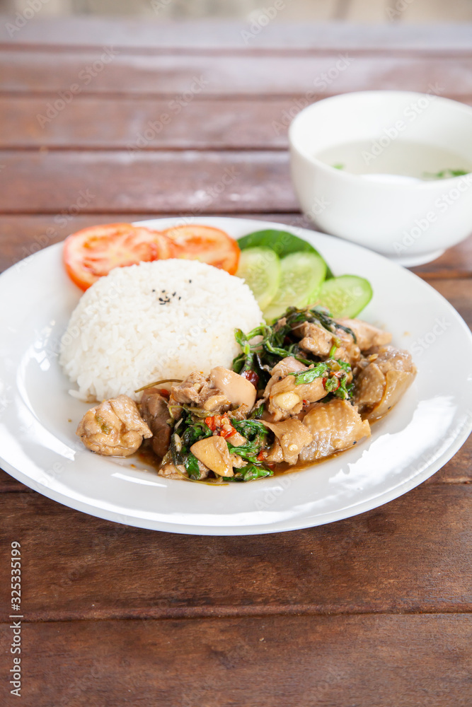 Rice topped with stir fried chicken and basil Rice topped with stir fried chicken and basil