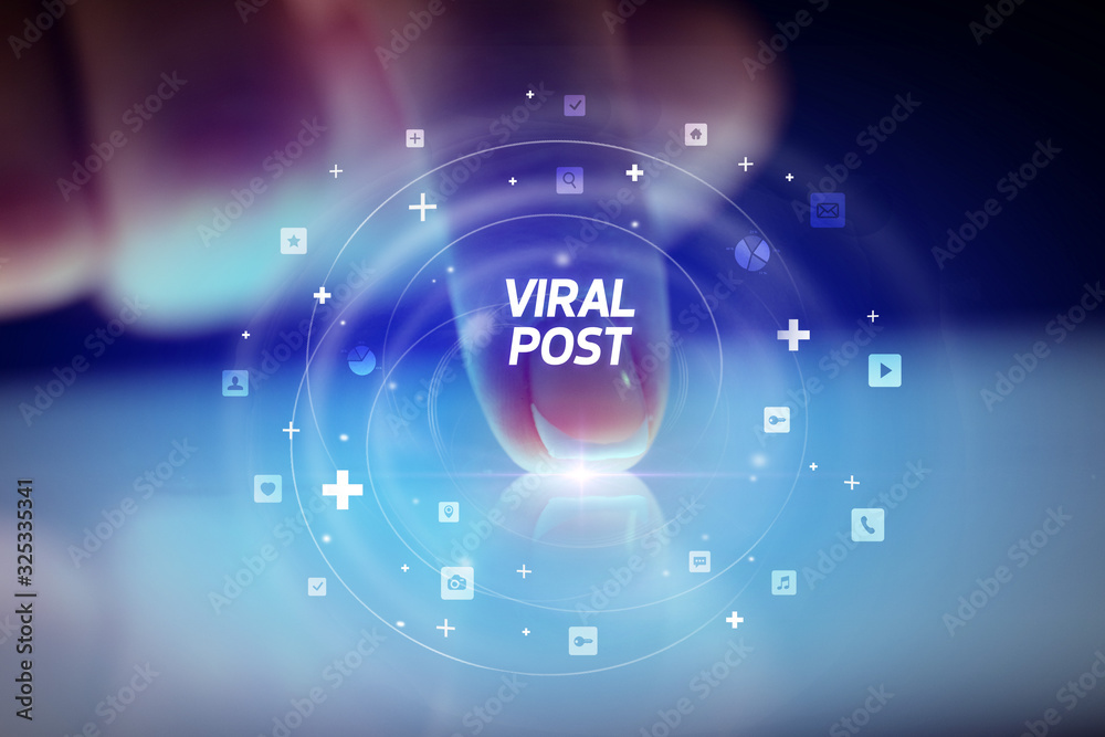Finger touching tablet with social media icons and VIRAL POST