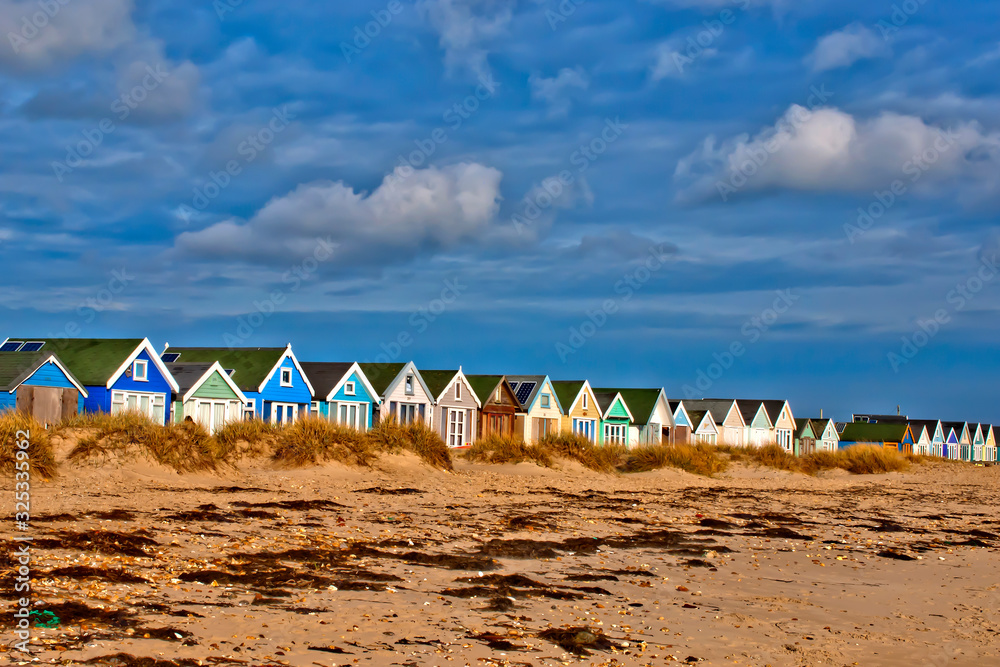 Hengistbury Head beach and beach huts near Bournemouth in Dorset, England