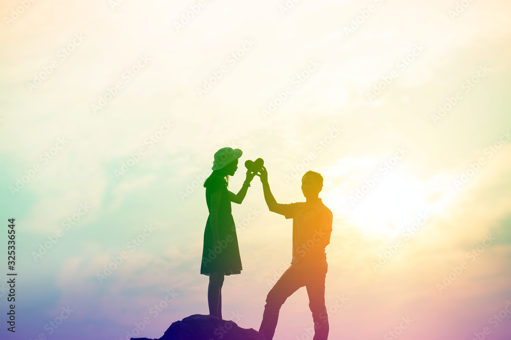 Fototapeta premium Couple enjoying outdoors in a wheat field.
