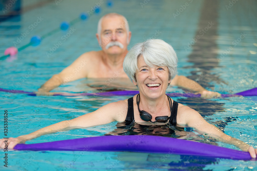 Fototapeta premium portrait of senior couple in pool