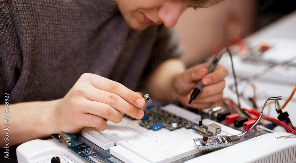 student making measurement and costruct the circuit board with engineer equipment, studying process student making measurement and costruct the circuit board with engineer equipment, studying process