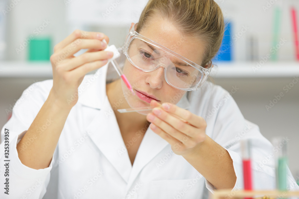 attractive student of chemistry working in laboratory attractive student of chemistry working in laboratory