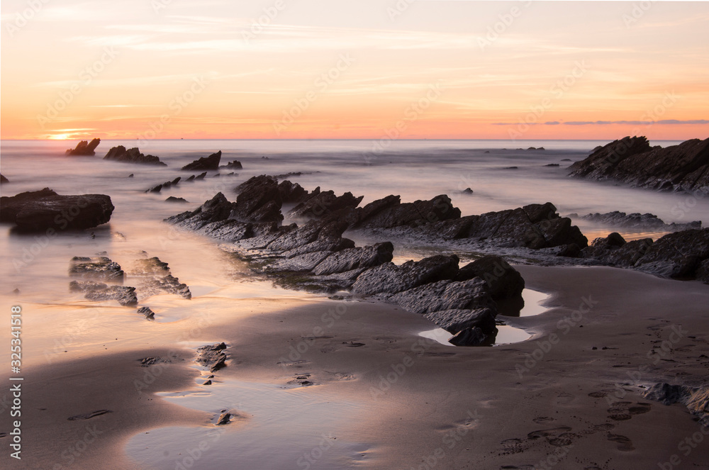 barrika beach at sunset in basque country, spain