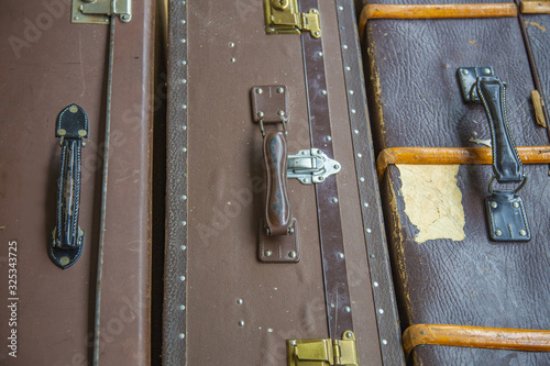 Vintage brown genuine leather suitcase for travel. Made in the mid 20th century photo