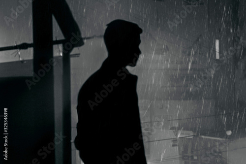 guy looks at the city black and white fog © Gheorghe
