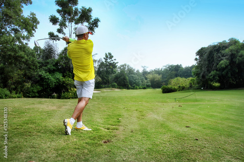 man playing golf in a golf course