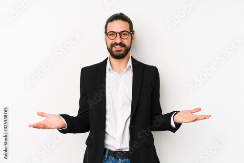 Young caucasian business man isolated on a white background showing a welcome expression.