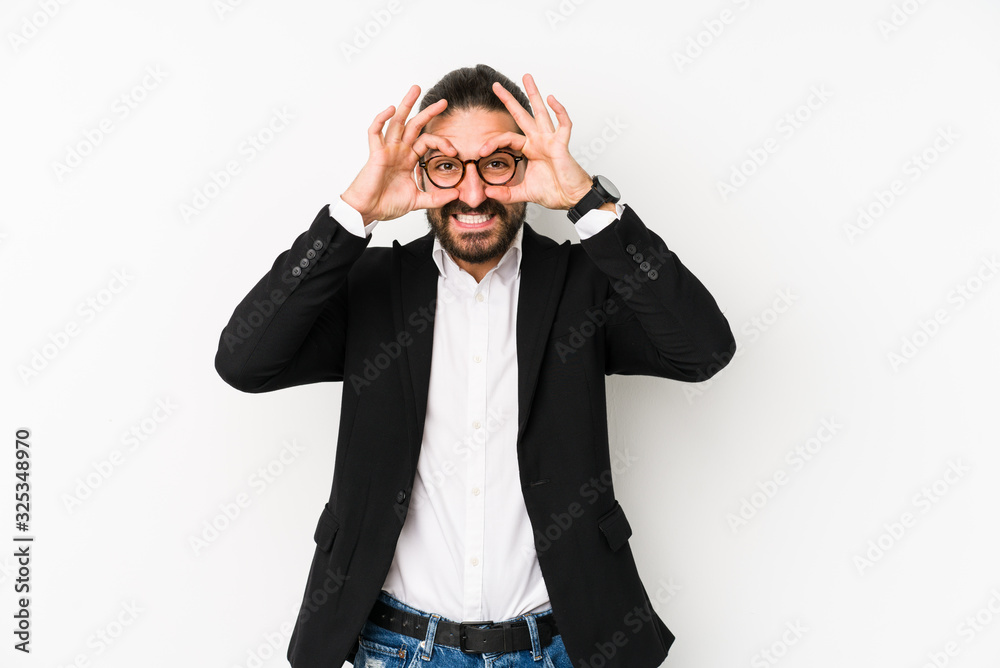 Young caucasian business man isolated on a white background showing okay sign over eyes Young caucasian business man isolated on a white background showing okay sign over eyes