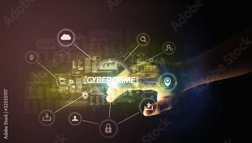 Hand touching CYBERCRIME inscription, Cybersecurity concept