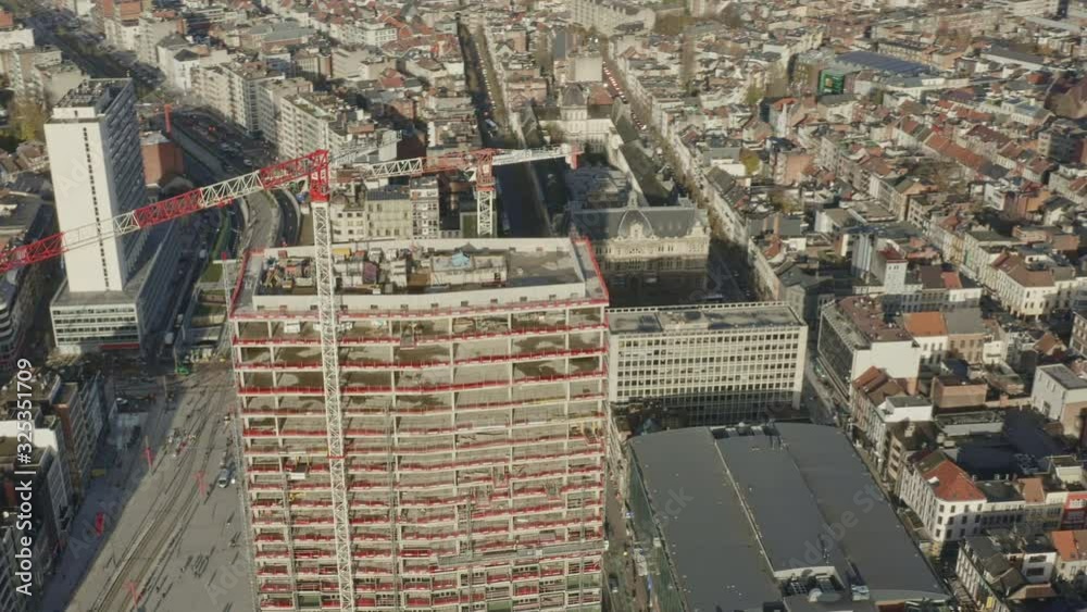 Antwerp Belgium Aerial v17 Birdseye view flying around tower under construction with cityscape and outer city views - November 2019 Antwerp Belgium Aerial v17 Birdseye view flying around tower under construction with cityscape and outer city views - November 2019