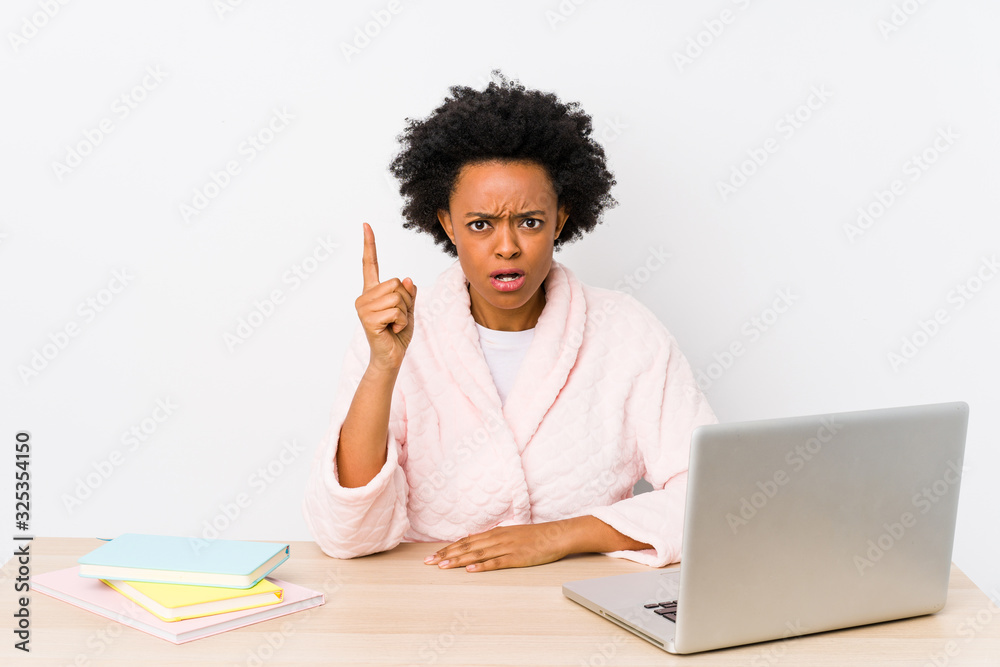Middle aged african american woman working at home isolated having an idea, inspiration concept. Middle aged african american woman working at home isolated having an idea, inspiration concept.